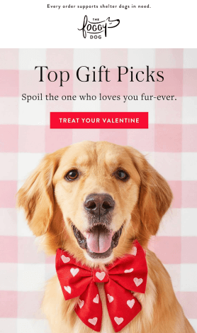 Golden Retriever wearing a heart-patterned Valentine's Day bandana and matching bowtie, sitting on a white background